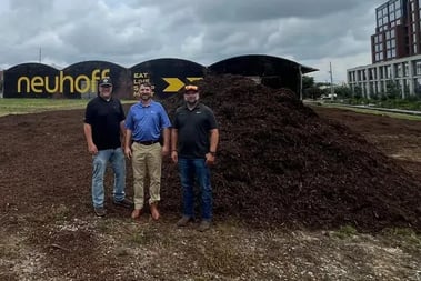 Project team beside donated recycled wood mulch at Neuhoff Dog Park in Nashville.